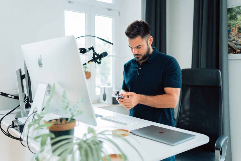 A thought leader at his computer using AI to help his work